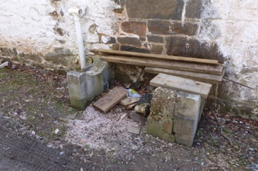 Possibly a bricked-up fireplace